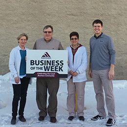 Bob Treitline and Staff in front of pharmcy in North Dakota