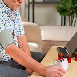 older man measuring blood pressure