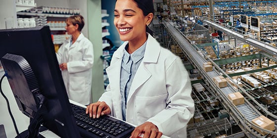 smiling pharmacist with at counter with computer v3