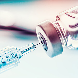 vaccine vial with needle